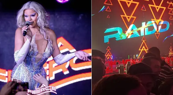 Une drag queen scintille sur scène à Paris, devant un logo lumineux. Ambiance festive dans ce bar trans.